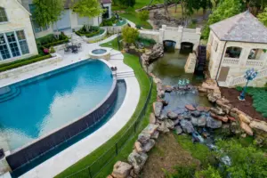 Flower Mound Infinity Pool with Water Wheel Claffey Pools