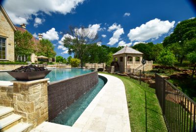 Flower Mound Infinity Pool with Water Wheel