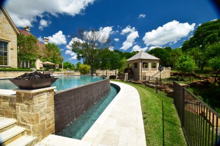 Flower Mound Infinity Pool with Water Wheel