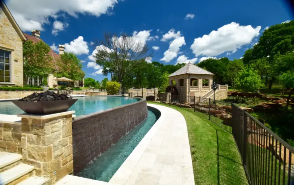 Flower Mound Infinity Pool with Water Wheel Claffey Pools