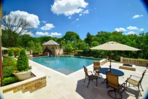 Flower Mound Infinity Pool with Water Wheel Claffey Pools