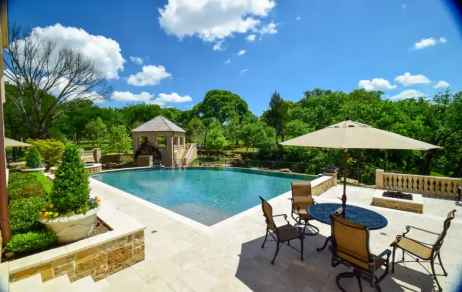 Flower Mound Infinity Pool with Water Wheel Claffey Pools