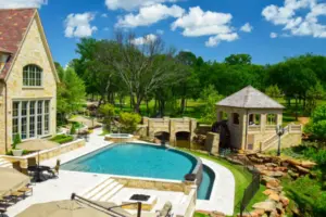 Flower Mound Infinity Pool with Water Wheel Claffey Pools
