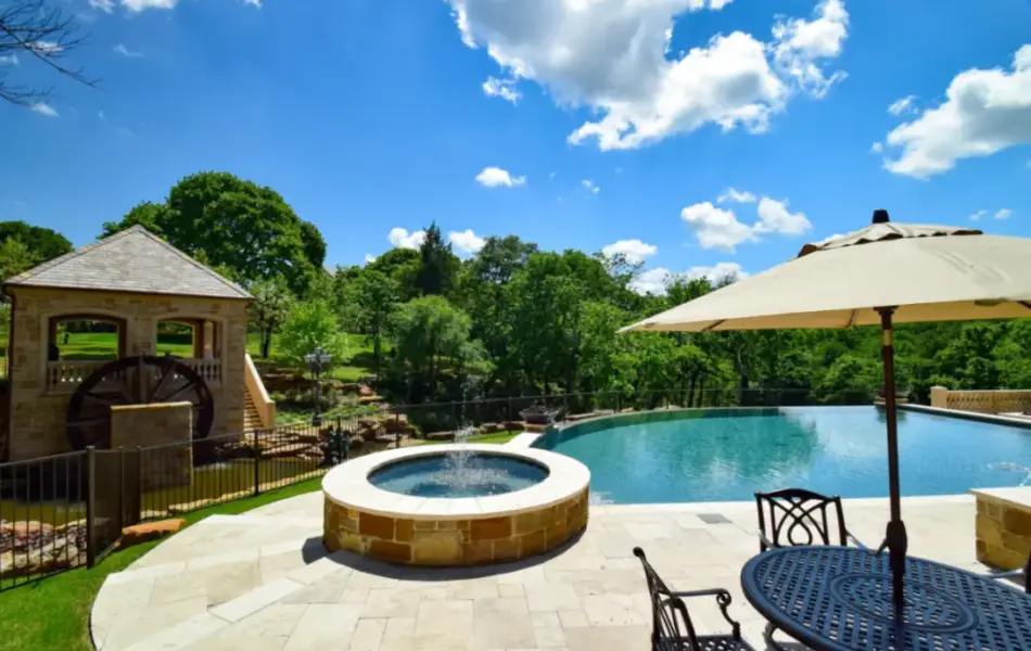 Flower Mound Infinity Pool with Water Wheel Claffey Pools