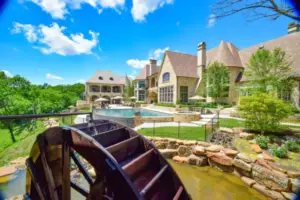 Flower Mound Infinity Pool with Water Wheel Claffey Pools