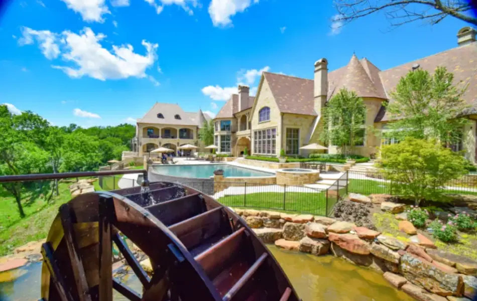 Flower Mound Infinity Pool with Water Wheel Claffey Pools