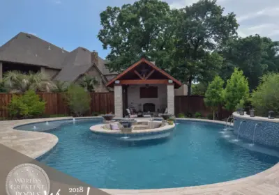 PEBBLE TEC AWARDS - worlds greatest pool 2018 winner - swimming pool with seating area and hot tub