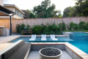 Pool side fire pit with seating area