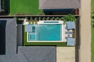 Bird's eye-view of geometric pool with integrated spa