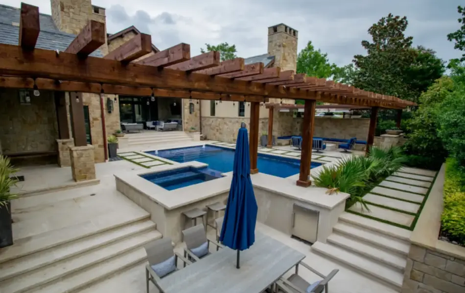 wooden arbor alongside geometric pool with integrated spa