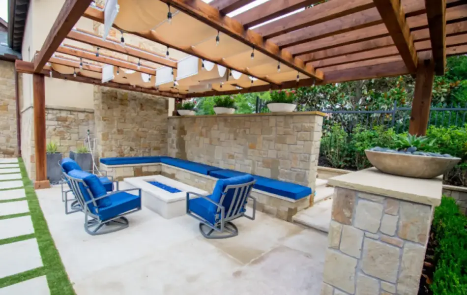 wooden arbor above outdoor seating area