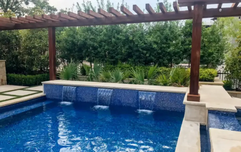 wooden arbor alongside geometric pool with water features