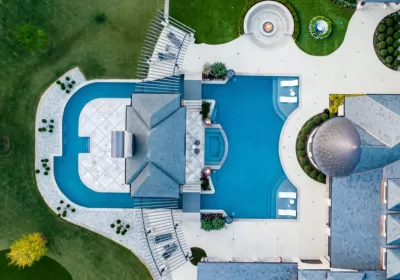 Bird's eye-view of luxury freeform pool surrounding house