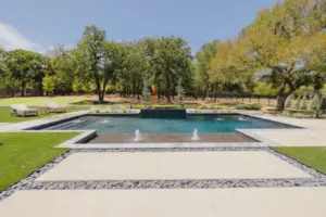 A swimming pool with fountains in