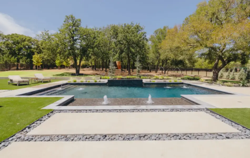 A swimming pool with fountains in
