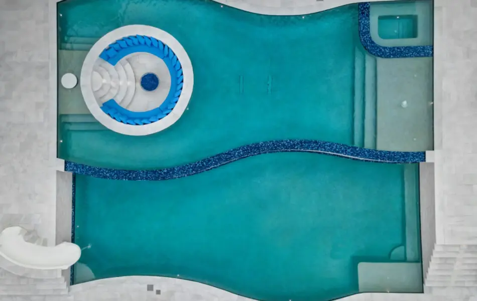 bird's eye-view of freeform pool with integrated sunken firepit