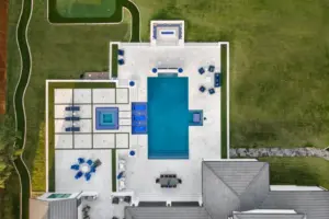bird's eye-view of geometric pool with tanning ledges