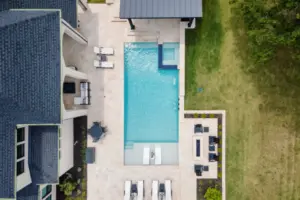bird's eye-view of geometric pool with tanning ledges