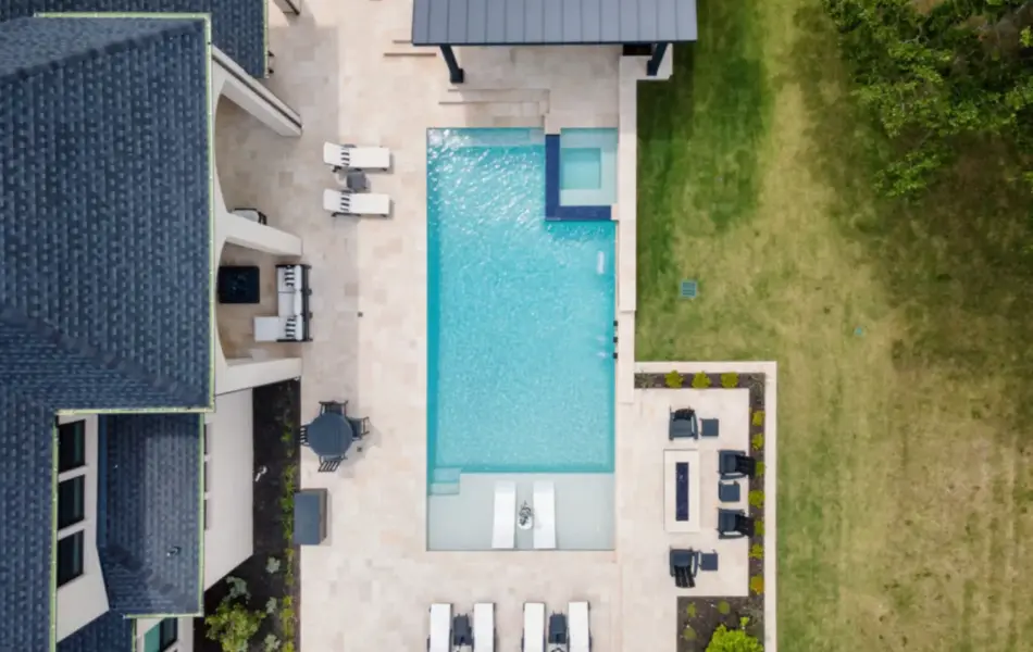bird's eye-view of geometric pool with tanning ledges