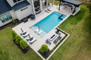 bird's eye-view of geometric pool with tanning ledges