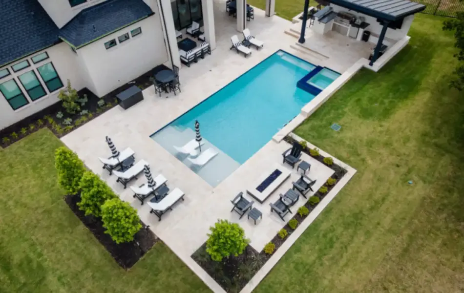 bird's eye-view of geometric pool with tanning ledges
