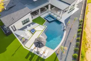 bird's eye view of freeform pool with integrated spa