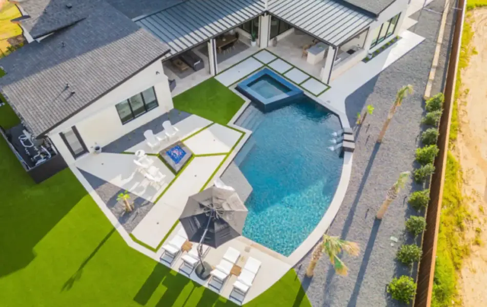 bird's eye view of freeform pool with integrated spa