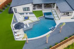 bird's eye view of freeform pool with integrated spa