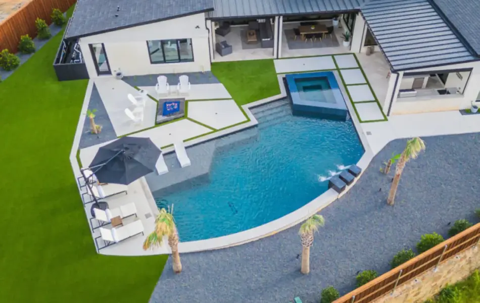 bird's eye view of freeform pool with integrated spa