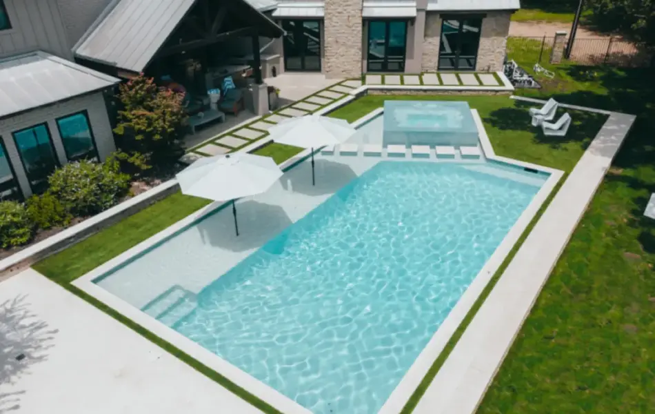 Bird's eye-view of geometric pool with integrated spa