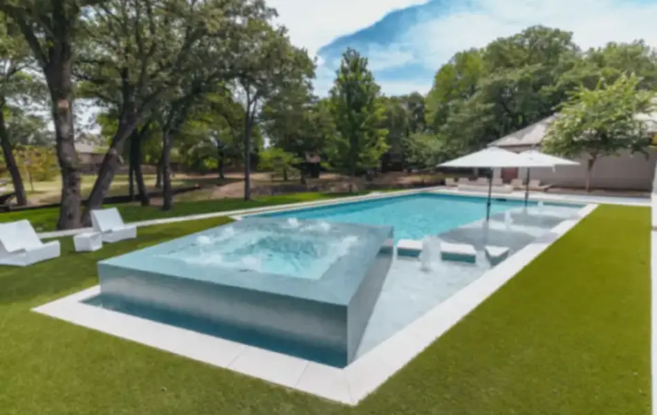 pool side view of integrated spa with water features